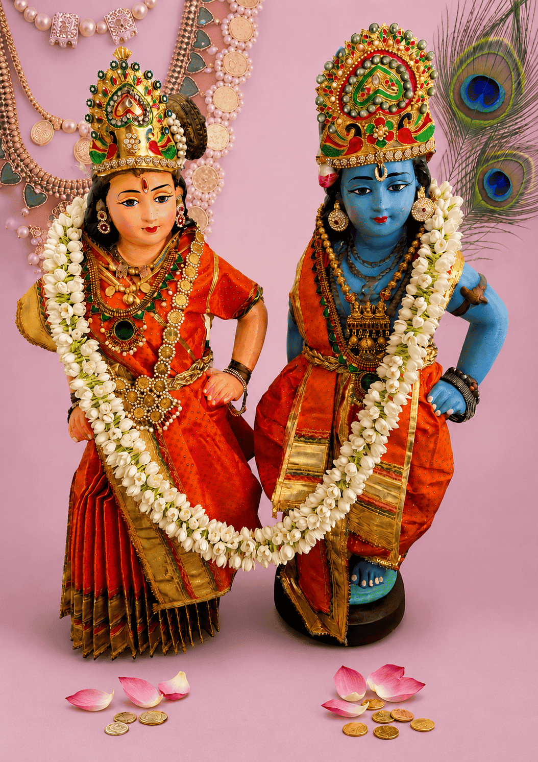 Radha and Krishna adorned in saffron and gold